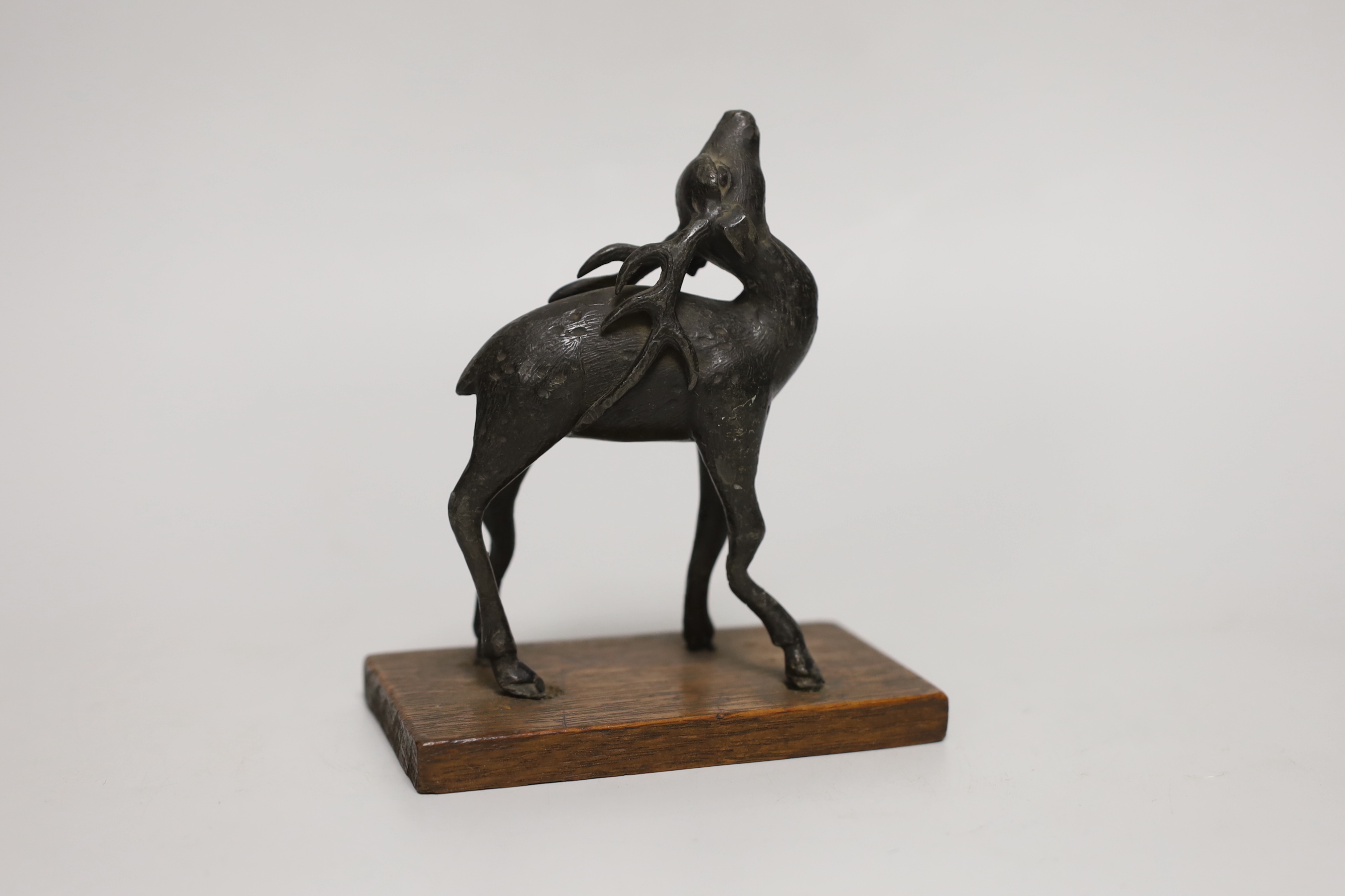 A small Chinese bronze figure of a standing deer, 13cm